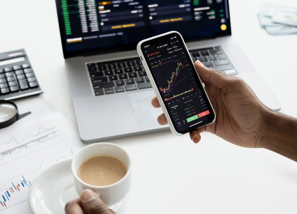 Man looking at stock chart on phone